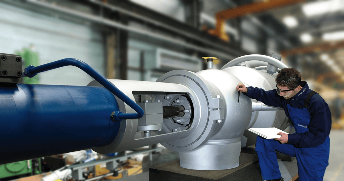 Man inspecting safety valve at IMI Bopp & Reuther site, Germany. Diligent, focused, ensuring reliability & adherence to safety protocols.