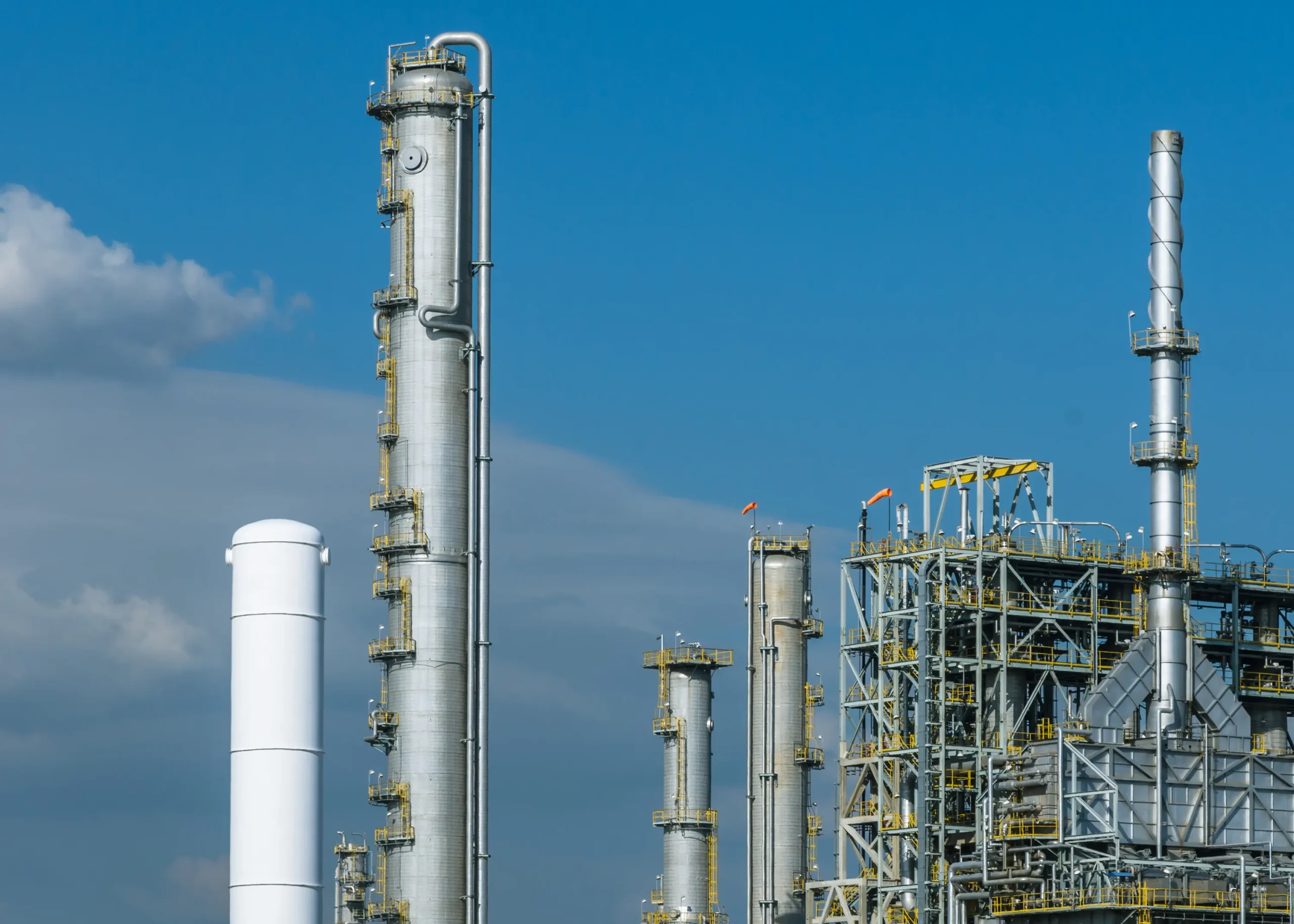 A plastic resin plant produces raw materials for plastic products through chemical reactions and refining processes.
