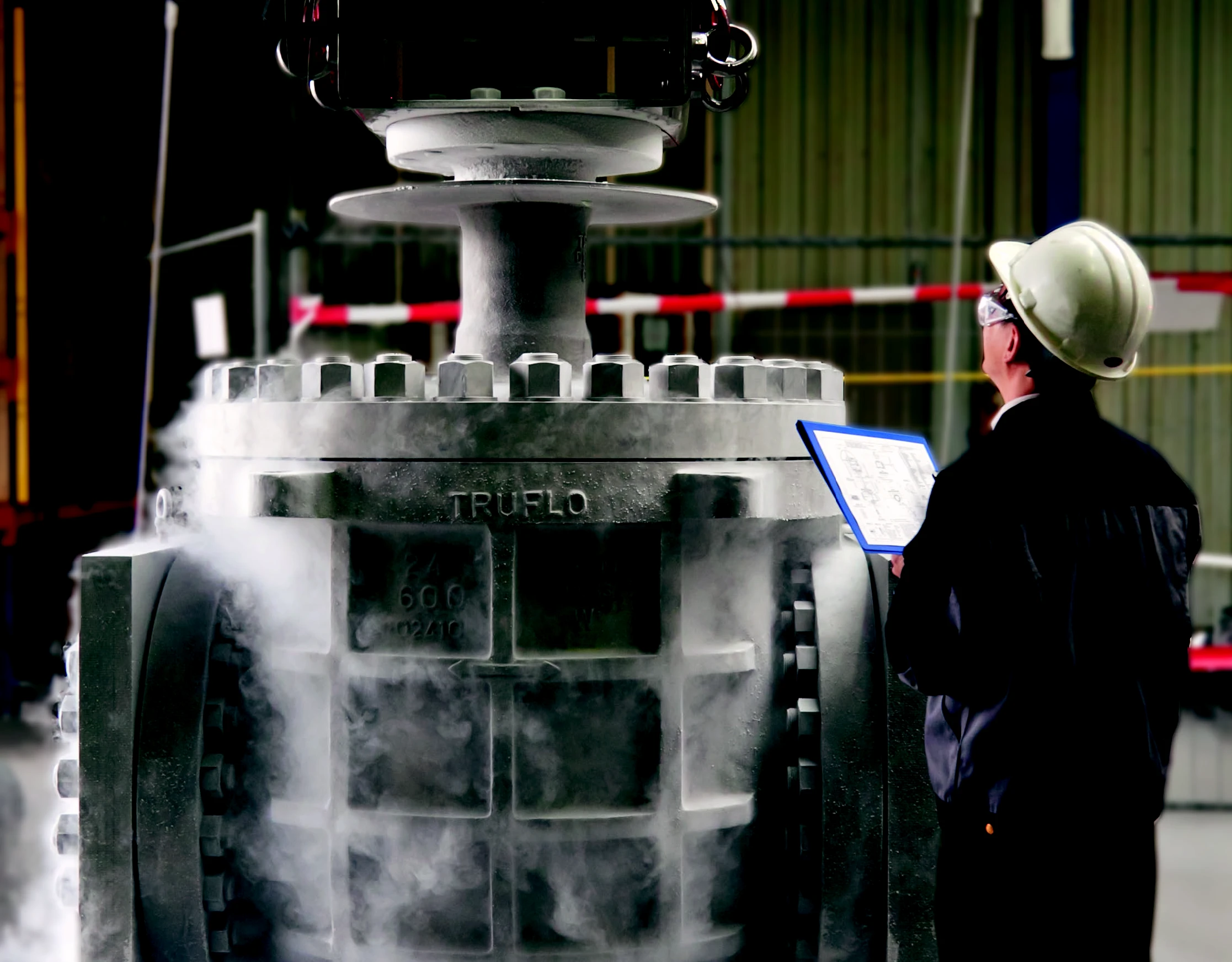 Technician testing an IMI Truflo Italy valve, ensuring functionality and reliability in industrial applications.