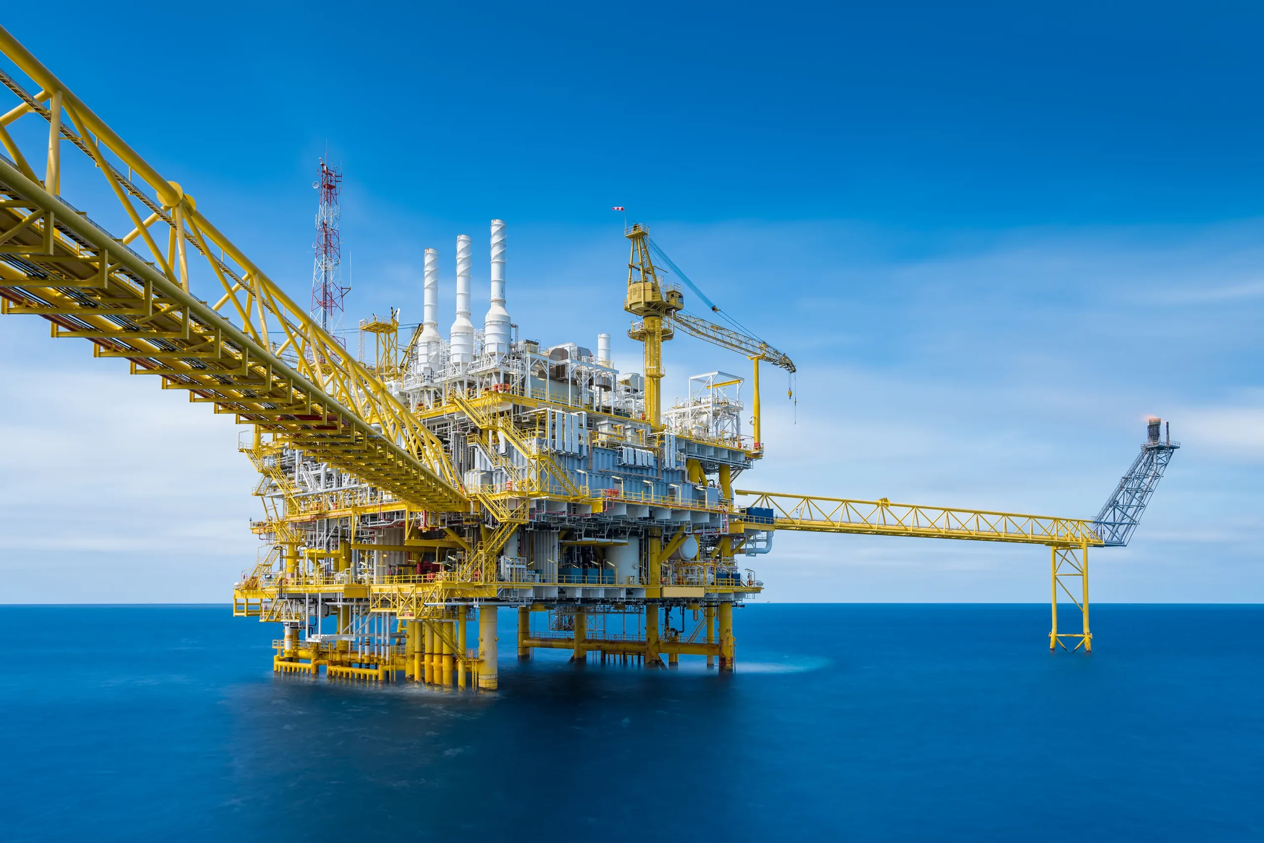An offshore oil and gas company with a processing platform that extracts crude oil and gas, destined for onshore refineries.
