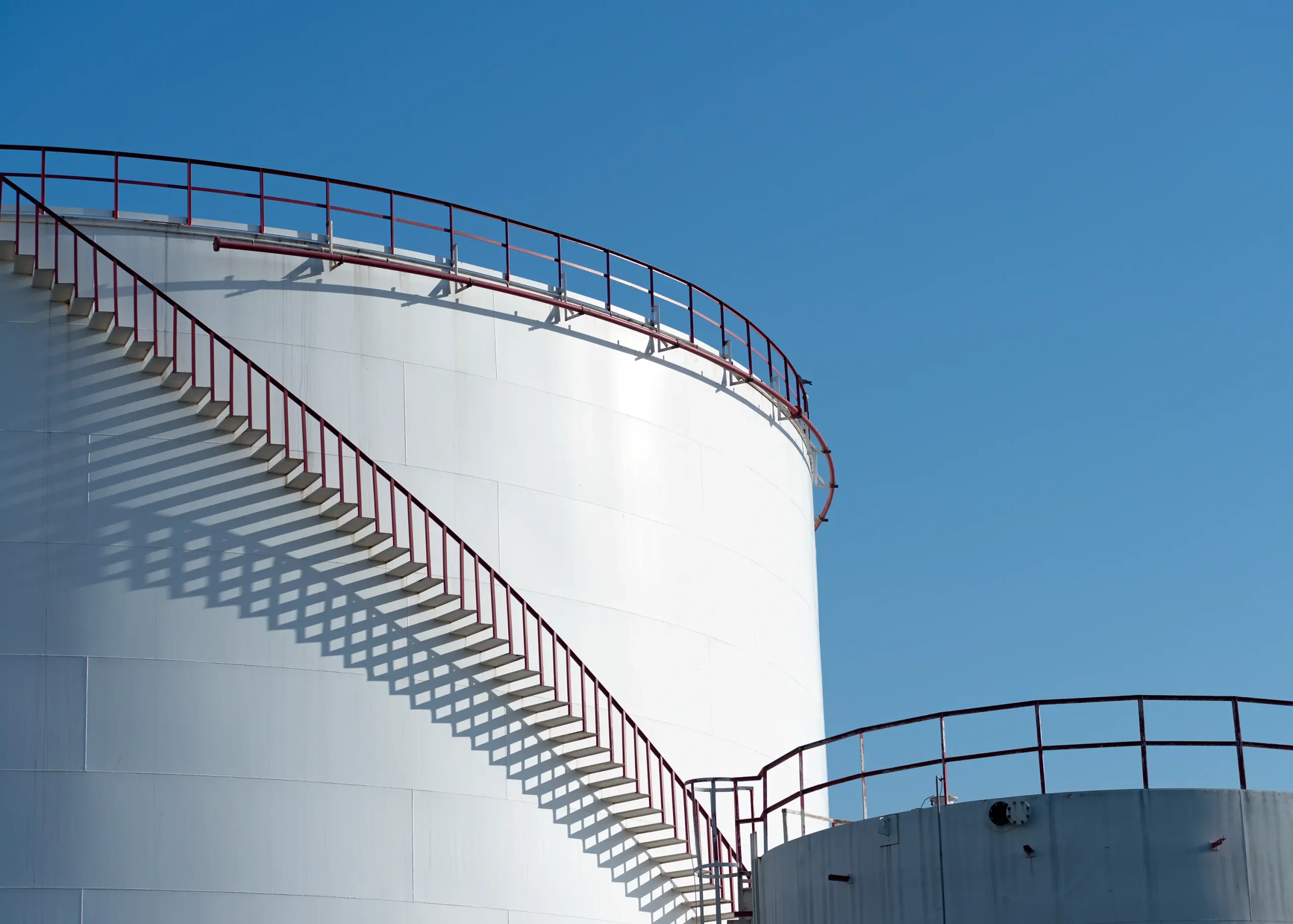 Fuel tank at a petrochemical site with precision control valves regulating flow for enhanced safety and efficiency
